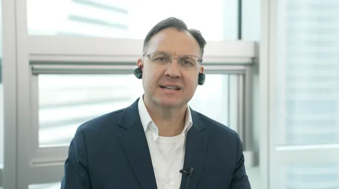 Josh, an accountant, wearing BeCozU earpieces