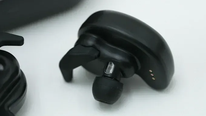 The BeCozU in-ear wearable being placed in the ear